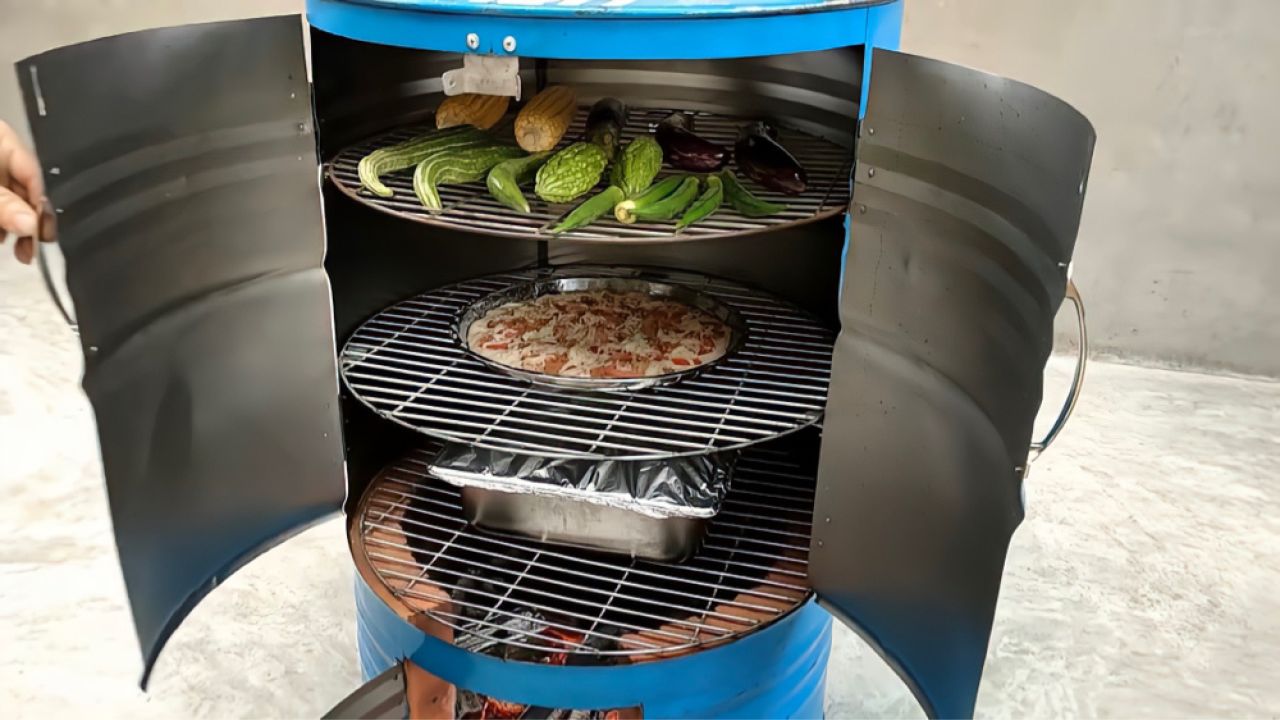 小伙用废弃油桶制作了一个多功能的柴火炉,制作简单又实用