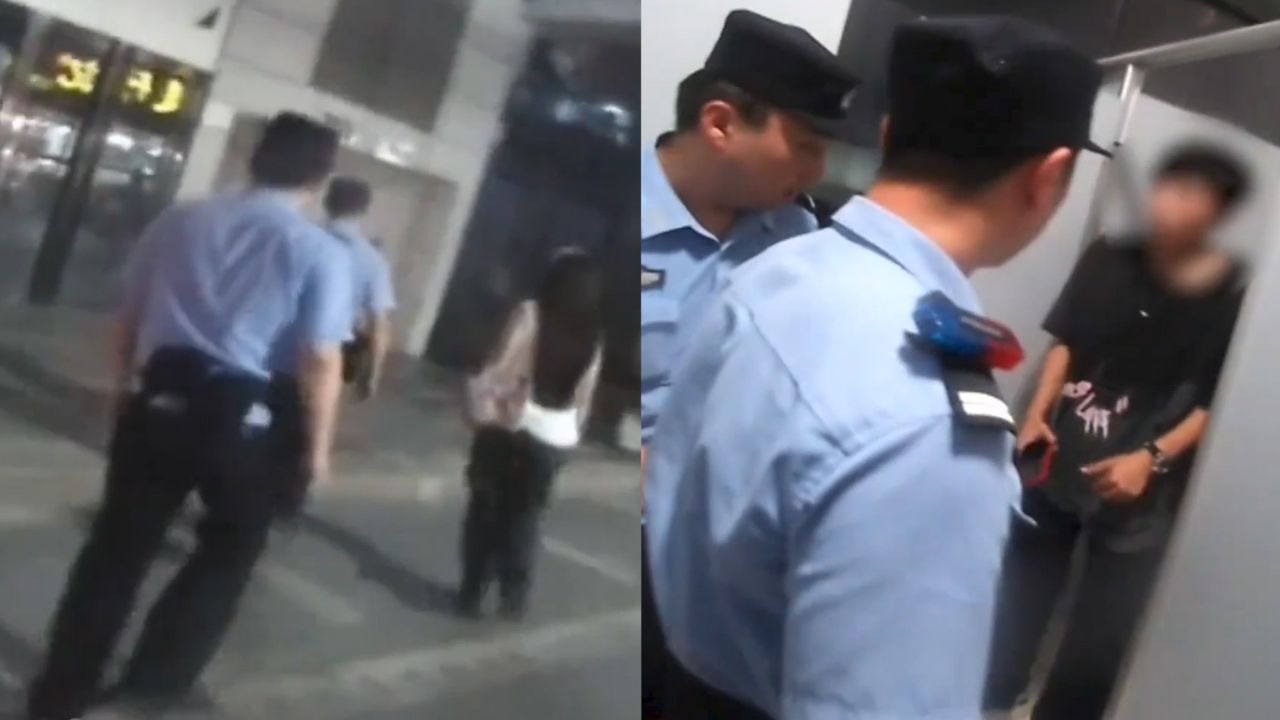 女子公厕换衣隔板缝隙发现被偷拍，男子躲厕所不出被民警围堵：行拘7日_高清